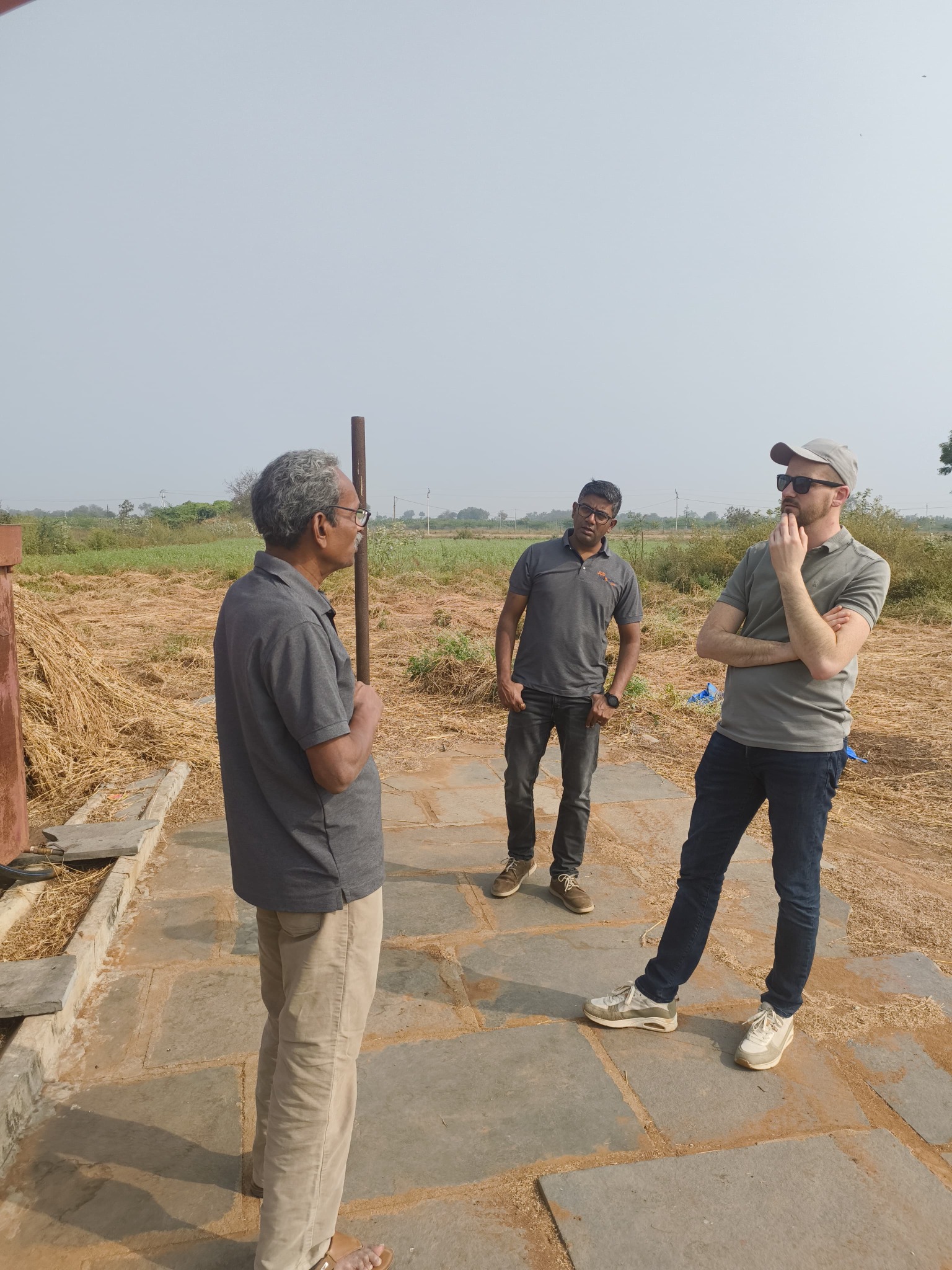 Mr. Devasagayam discussing an agricultural project during a field visit